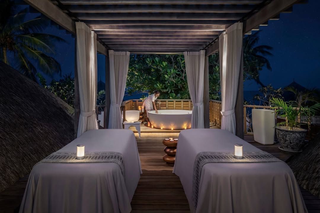 Open-air spa pavilion at night