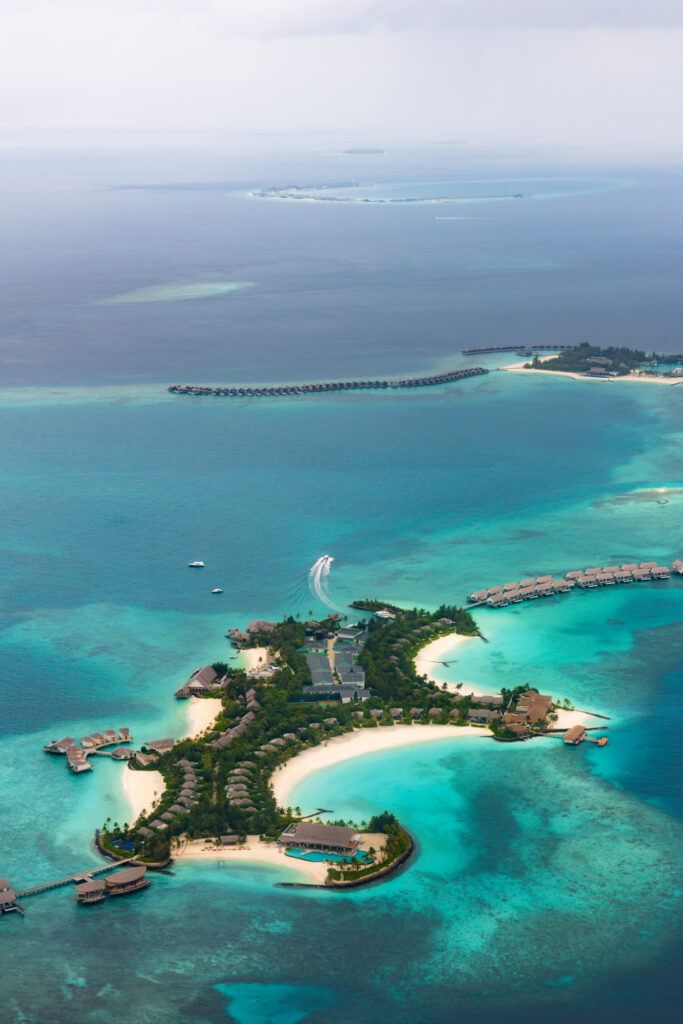 Aerial view of an atoll and its resort islands